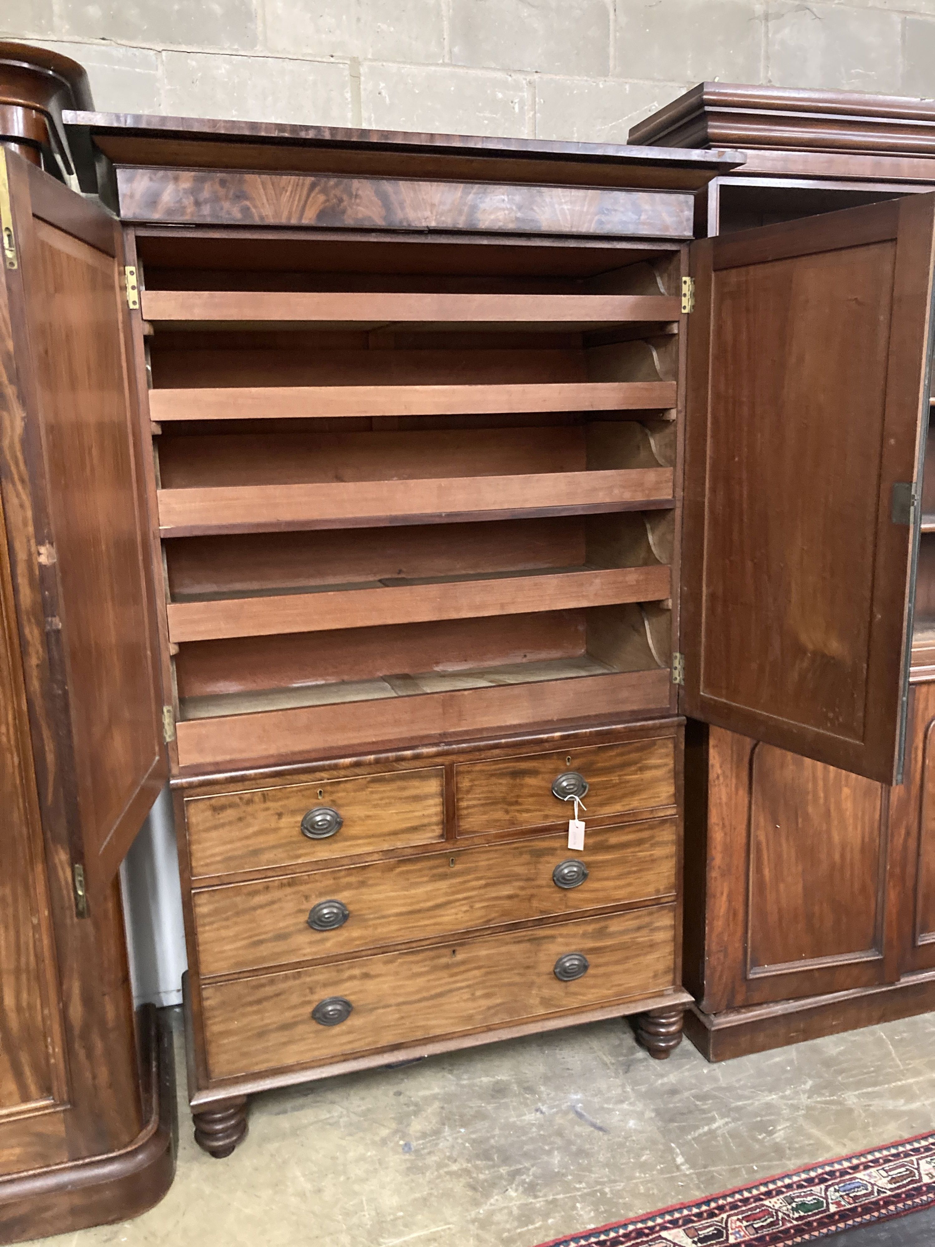 A Victorian figured mahogany linen press, width 130cm, depth 56cm, height 218cm